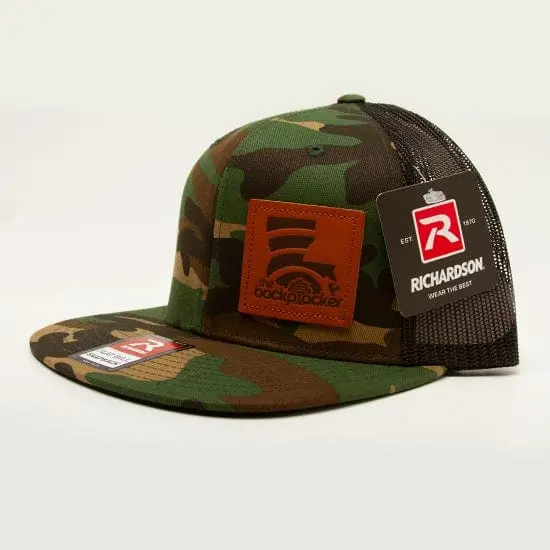 The Backpacker Louisiana Logo Mesh Back Hat – Green Camo & Black Trucker Style